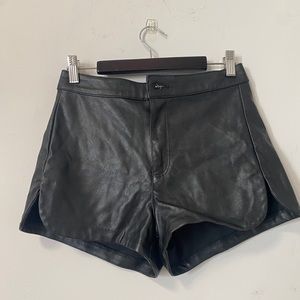 Black faux leather high waited shorts with short side slits
